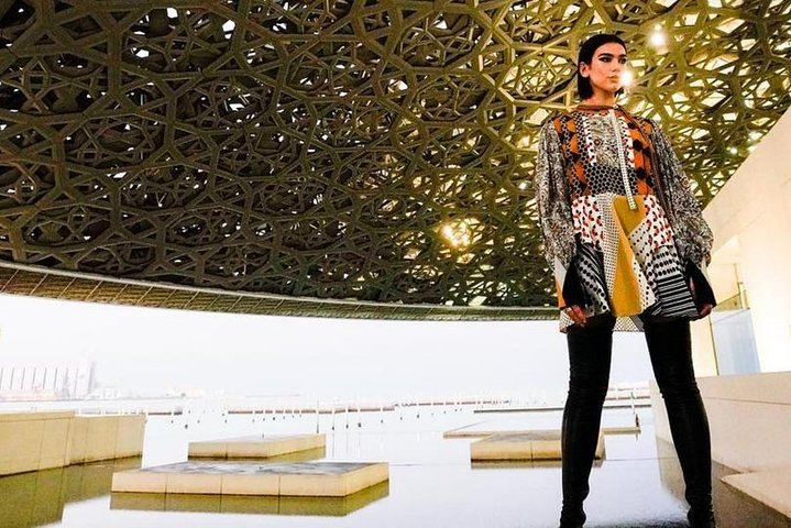 Discover the unique fusion of art and architecture at the Louvre Abu Dhabi where each step reveals treasures spanning cultures and eras all under a stunning geometric canopy.